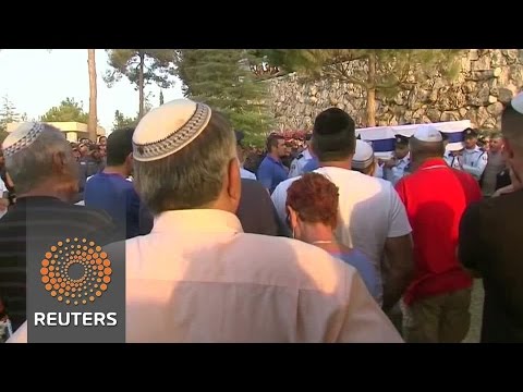 israel buries policeman killed in shooting spree