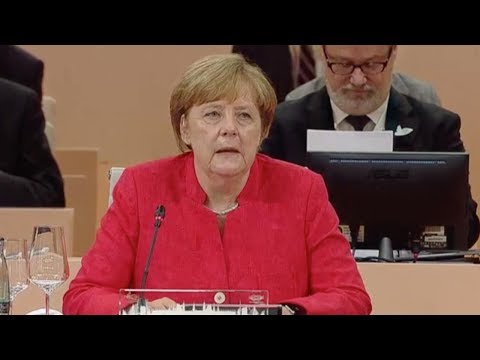 merkel urges cooperation to help africa