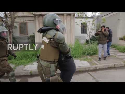 chile water cannon blasts protesters amid clashes