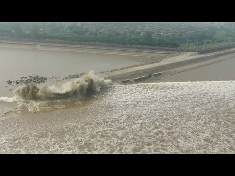 spectacular tidal bore along qiantang river mesmerizes thousands