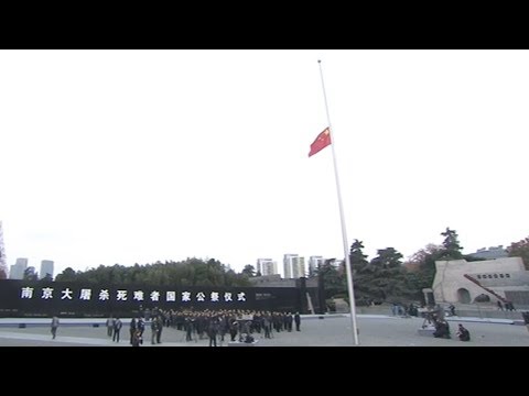 chinese flag at halfmast for massacre victims