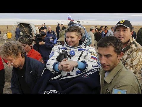 recordbreaking russian cosmonaut returns to earth