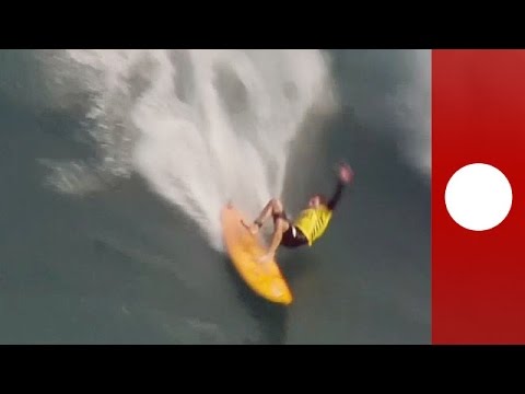 surfers take on epic 50ft waves