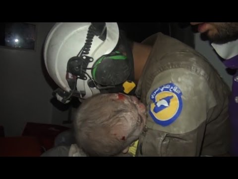 rescuer weeps after saving syrian baby