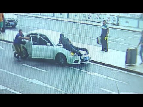 police officer taken for ride on fleeing vehicle