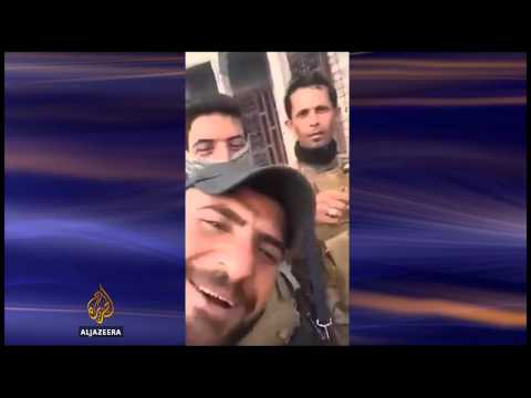 iraq video purports to show shia militia burning body