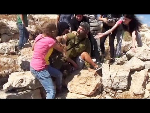 palestinian women force israeli soldier to release boy